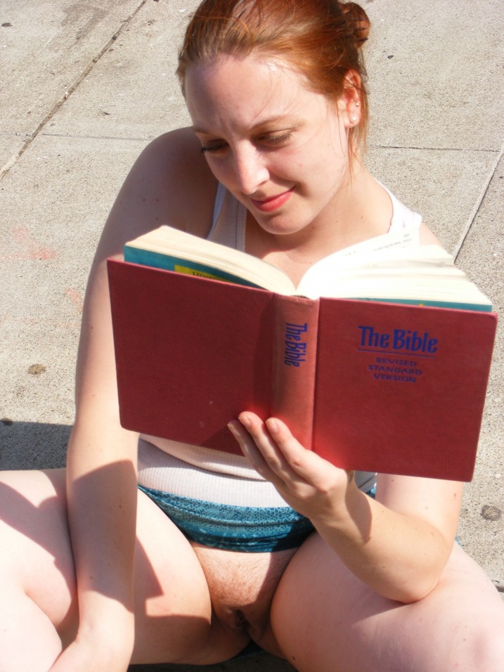 Public upskirt view of pussy of redheaded girl reading Bible